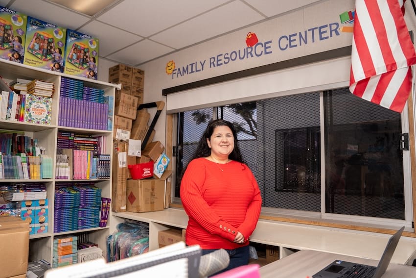 A woman standing in a Family Resource Center