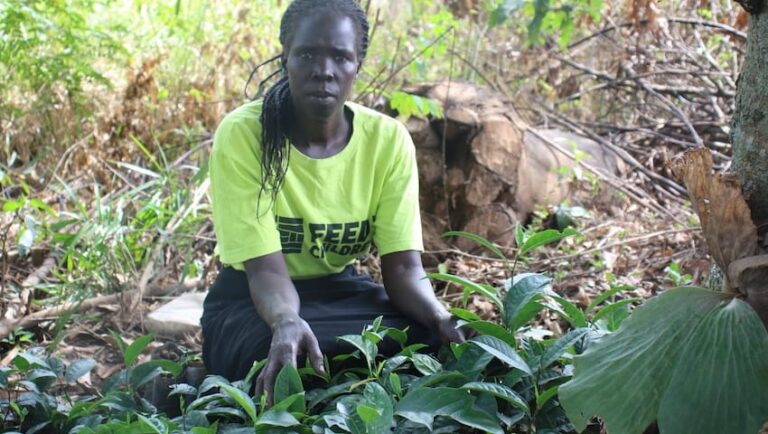 A woman with plants outdoors